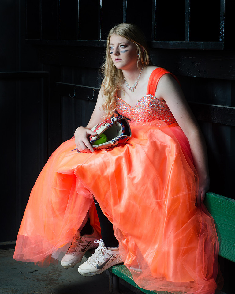 Senior girl in formal gown, playing softball in Brenham Texas
