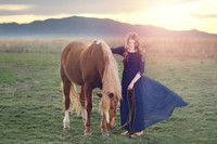 portrait girl in long blue dress with a horse