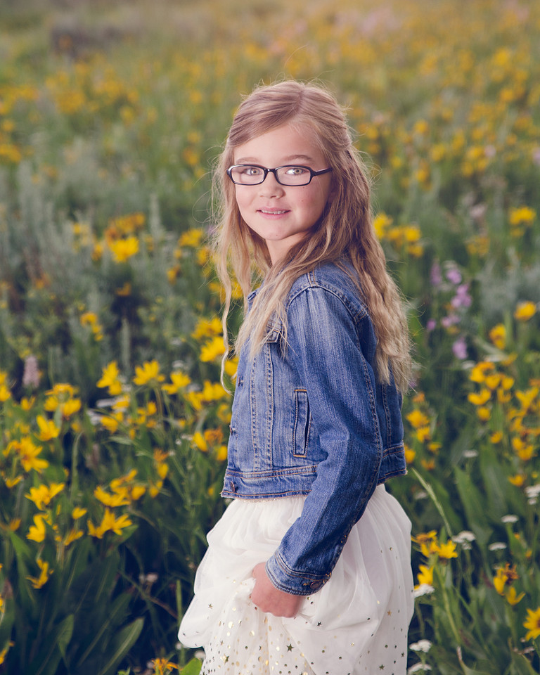 girl in the wildflowers from a session taken by Skylight Studio out of Pocatello Idaho